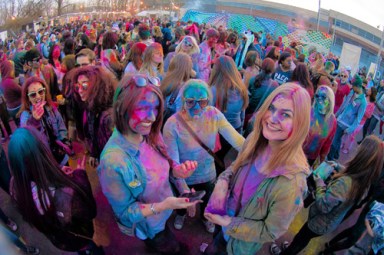 Color scheme: Partygoers dance in powdered paint at Holi-inspired fest