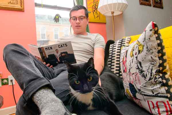 Of meows and men: Photo book focuses on cats and their manly owners
