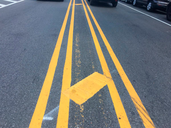 yellow diagonal stripes road