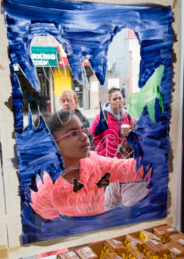 Festive field trip: Ridge kids cut class to paint windows in annual fall event