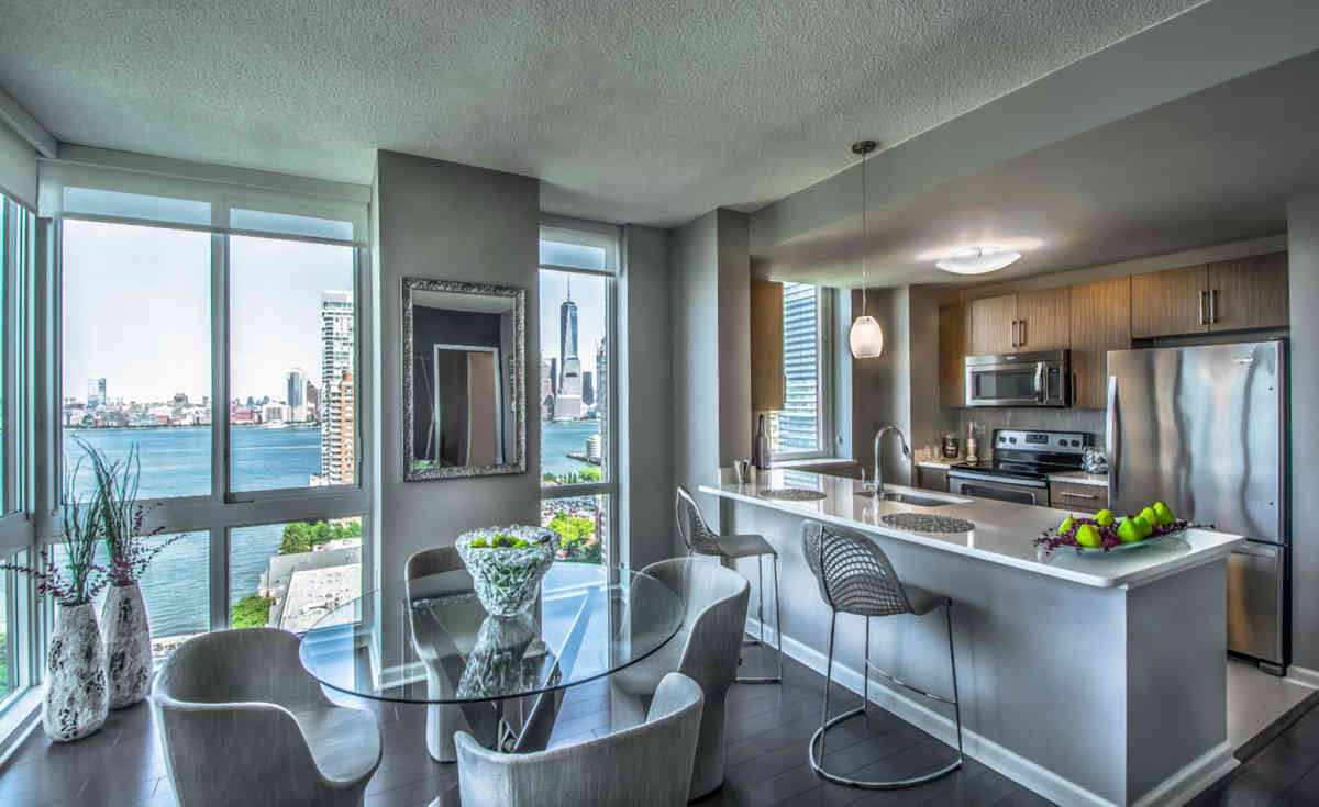 High-rise rentals on Jersey City waterfront feature club rooms and pet-friendly happy hours