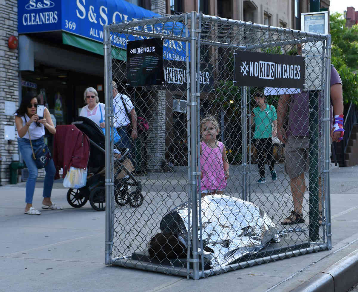 Chilling artistic replicas of caged children pop up across the city
