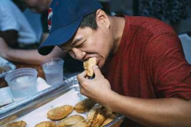 Easy as pie! Sloper wins empanada-eating comp at Fifth Ave. street fair