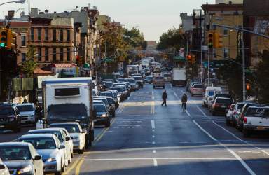 Commuters wait in their cars to drive over the Williamsburg Bridge into the Manhattan borough of New York