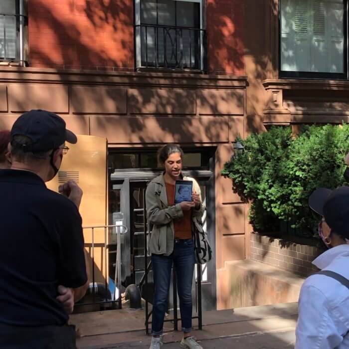 Lucie Levin talks as she leads one of a series of walking tours