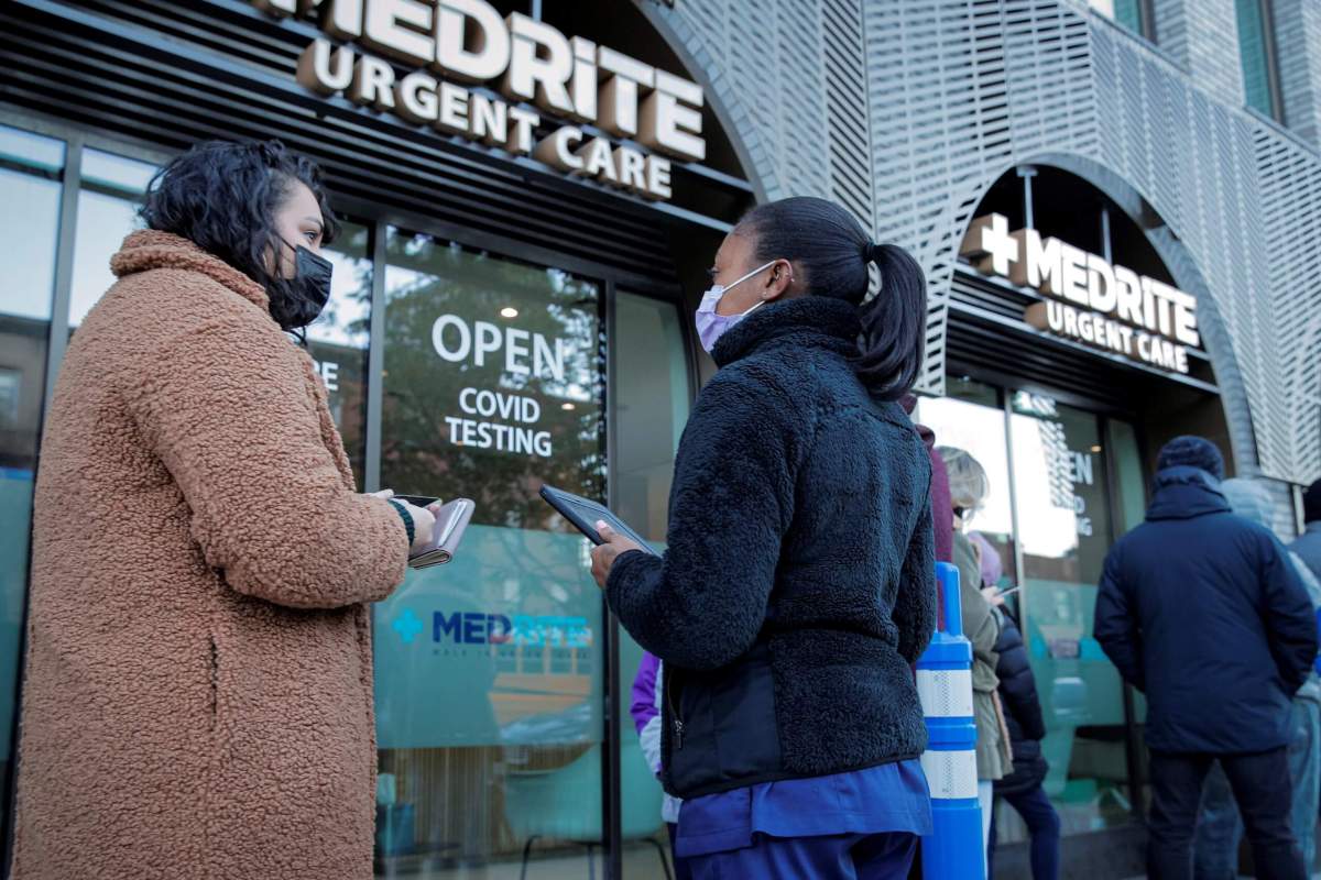 People line up to receive coronavirus disease (COVID-19) tests at a testing center in Brooklyn, New York