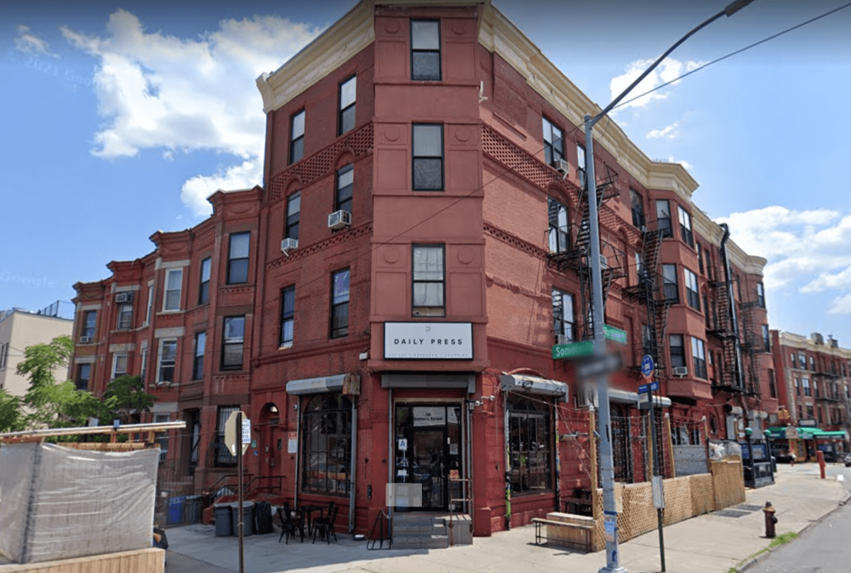 the daily press, a red brick coffee shop on a corner