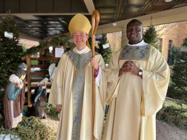 Bishop Brennan ordains new transitional deacon Samuel Mwiwawi on Jan. 7, 2023.