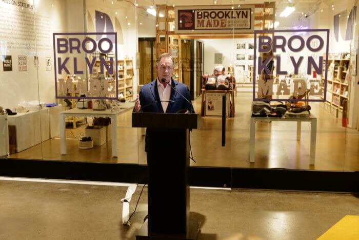 Randy Peers, CEO and president of the Brooklyn Chamber of Commerce celebrates opening of borough's first merchandise store.