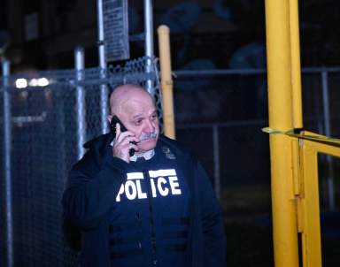 NYPD officer from 75t precinct following a double shooting in East New York.