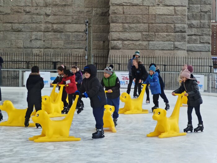 kids skating learning to skate with the help of disney instructors