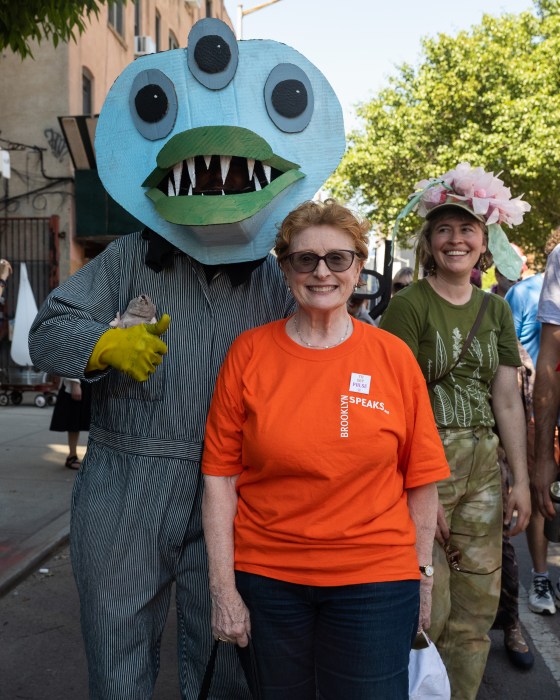Jo Anne Simon with person in three-headed fish outfit at Gowanus Art Parade