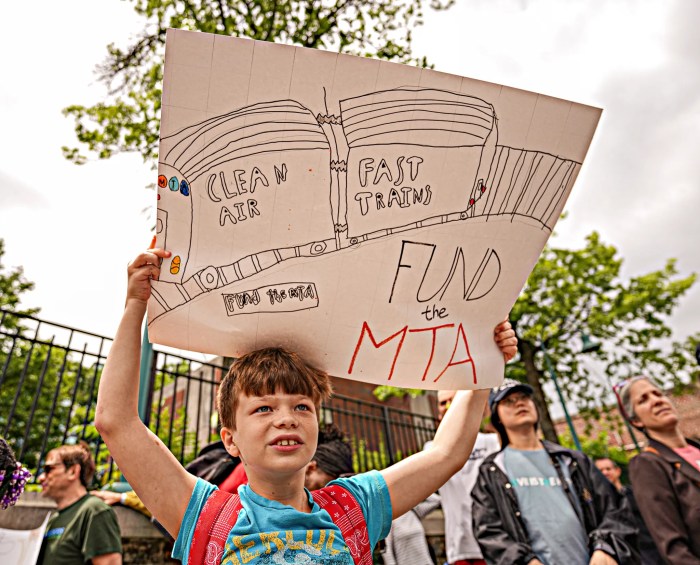 child with congestion pricing sign